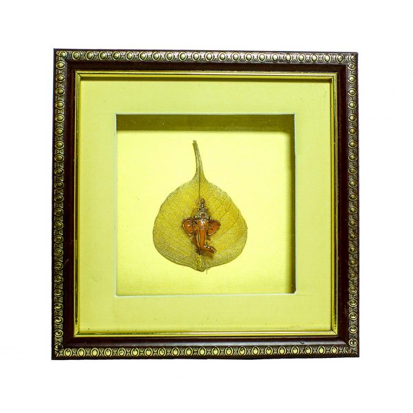 Frame with beautiful statue of Ganpati embedded on gold plated peepal leaf