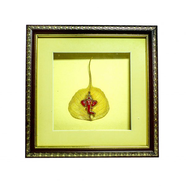 Frame with beautiful statue of Ganpati embedded on gold plated peepal leaf